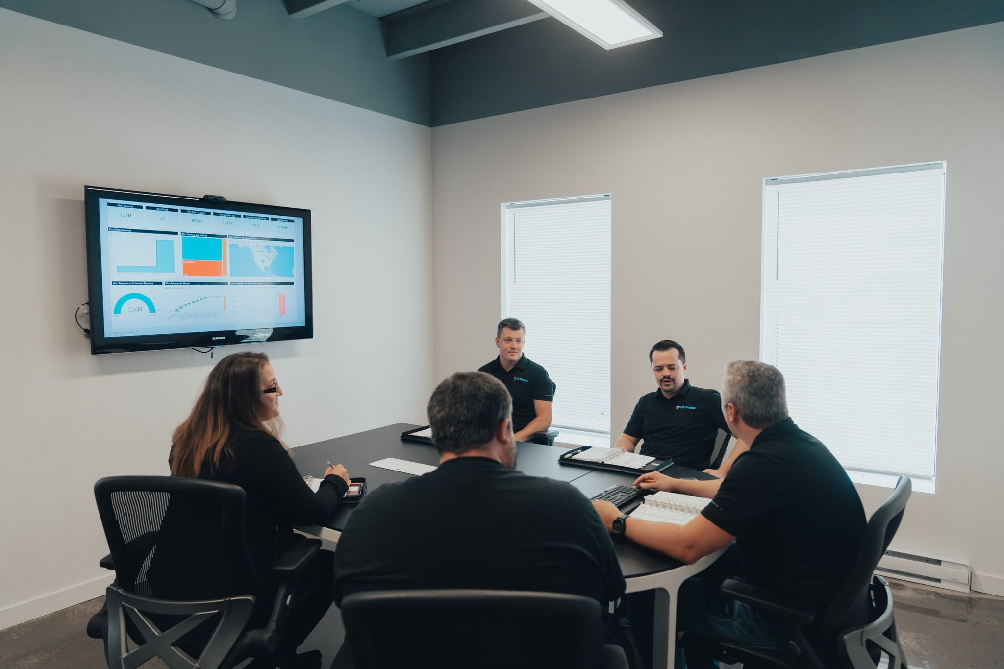 The administration team of G.M. Précision in meeting